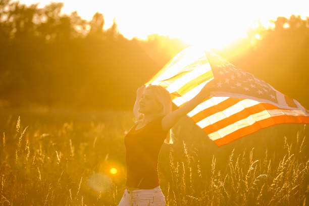 istock Beautiful Young Woman with USA Flag 1279106321