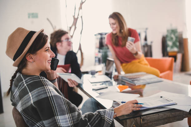 istock Team of young designers  cooperating in the office. 1279106328