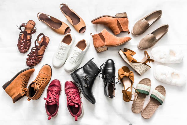 Variety of women's fashion comfortable shoes of all seasons on a light background, top view Variety of women's fashion comfortable shoes of all seasons on a light background, top view shoes stock pictures, royalty-free photos & images