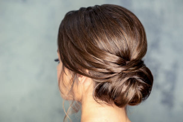 istock Brunette woman with middle bun hairstyle 1279108599