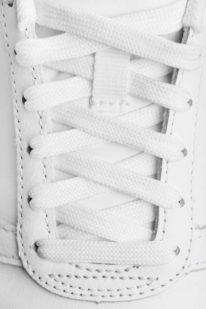 istock Women's leather white sneakers 1279109815