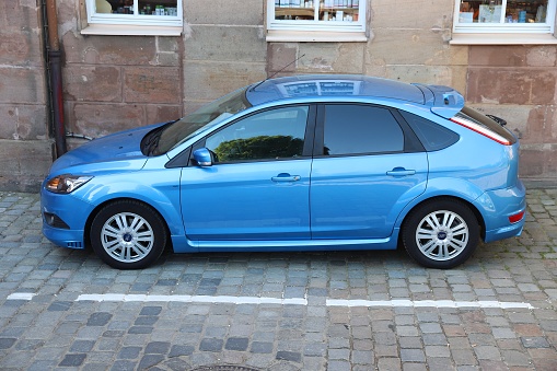 Ford Focus hatchback compact car parked in Germany. There were 45.8 million cars registered in Germany (as of 2017).