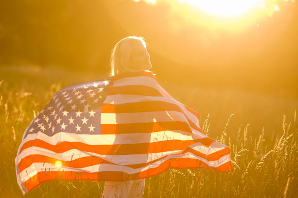 istock Beautiful Young Woman with USA Flag 1279110211