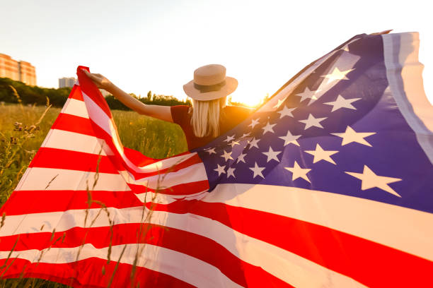 istock Beautiful Young Woman with USA Flag 1279110278