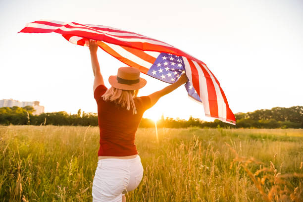 istock Beautiful Young Woman with USA Flag 1279110407