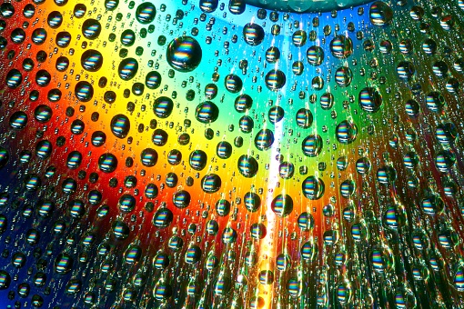Macro of water drops on multicolor background.
