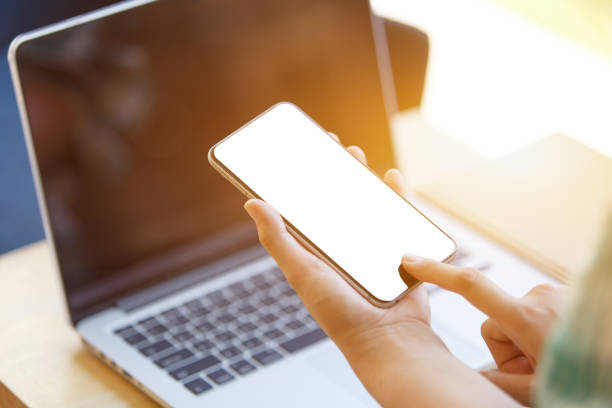 istock business woman using smart-phone on wooden table with laptop 1279112242