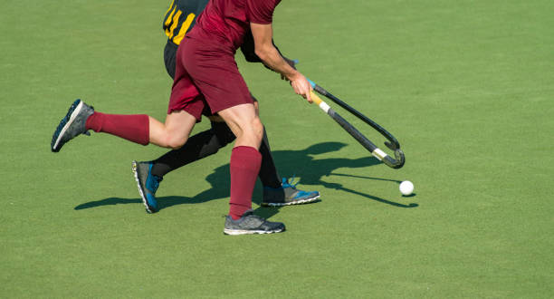 istock Low Section Of Men Playing Field Hockey 1279113064