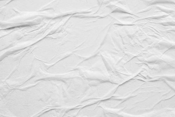 istock Blank white crumpled and creased paper poster texture background 1279114224