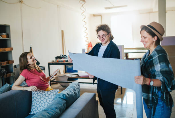 istock Team of young designers  cooperating in the workshop 1279114456