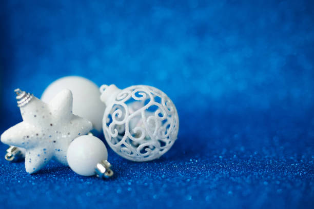istock White Christmas balls with decoration on shiny background 1279115976