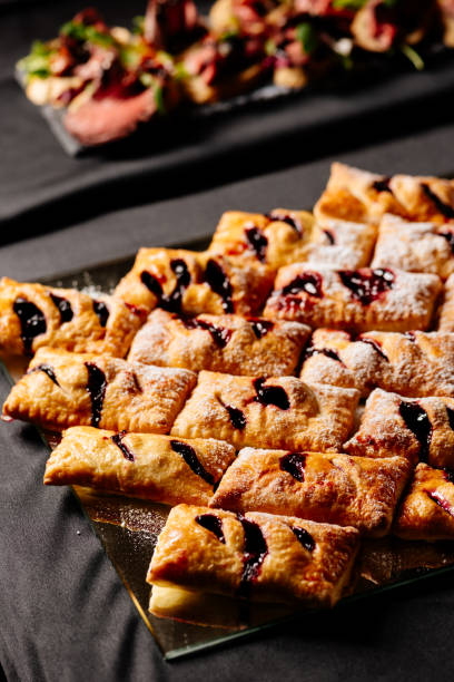 istock Sweet puff buns sprinkled with powdered sugar 1279116363