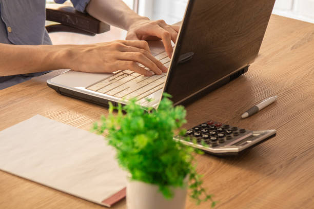 istock close-up of hands typing on laptop at desk 1279116476