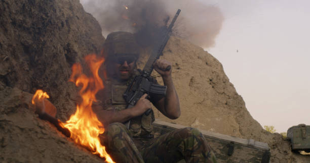 istock Scared soldier firing gun in air 1279117552