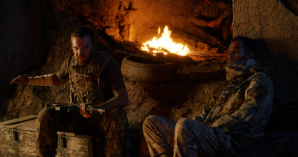 istock Angry military men resting near fire 1279117707