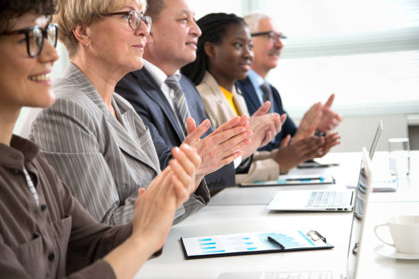 istock Business people clapping hands at business seminar. 1279117735