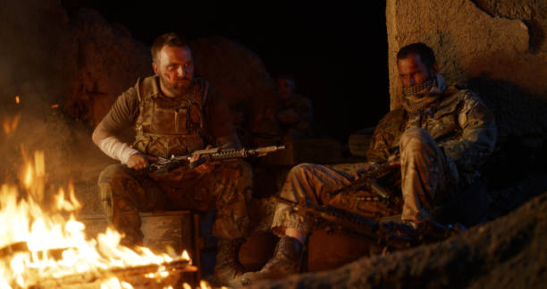 istock Angry military men resting near fire 1279117885