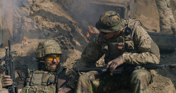 istock Squad mates speaking in trench 1279118102