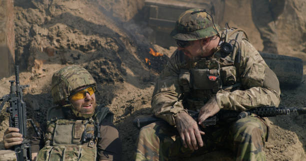 istock Squad mates speaking in trench 1279118103