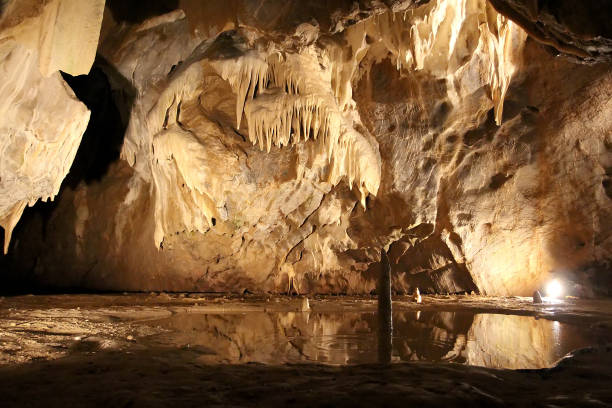 istock Cave with stalactites and stalagmites. Geological formation karst 1279118140