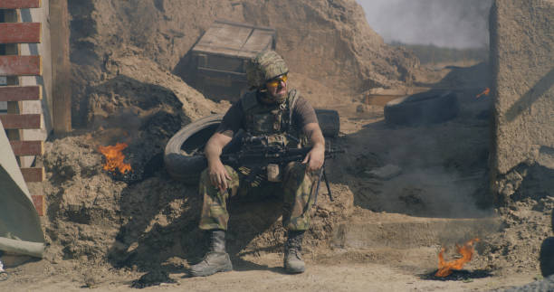 istock Male soldier resting during war 1279118183