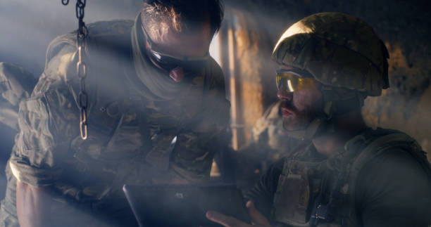 istock Military man threatening male prisoner 1279118226