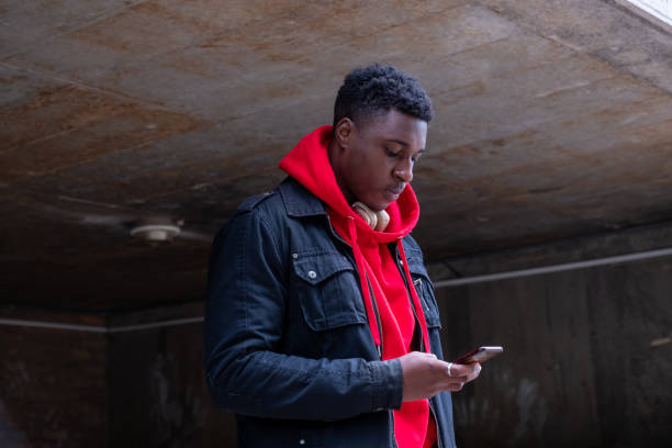 istock Confident African male student using mobile phone 1279118625