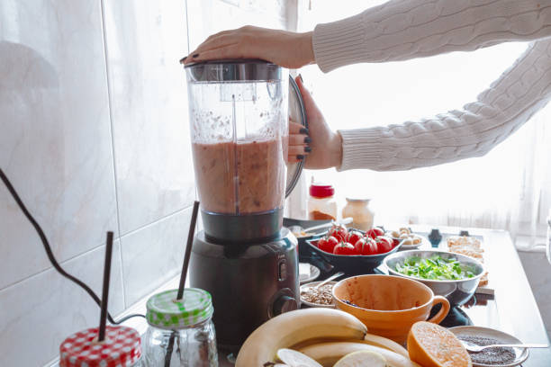istock Preparing healthy fruit and vegetable smoothie in the kitchen 1279119601