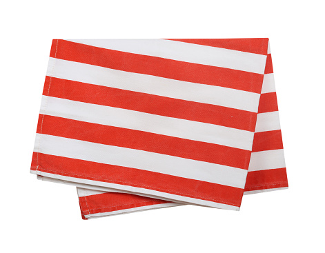 Folded kitchen towel isolated on white.Red stripes white domestic napkin.Cotton cloth christmas food decor.