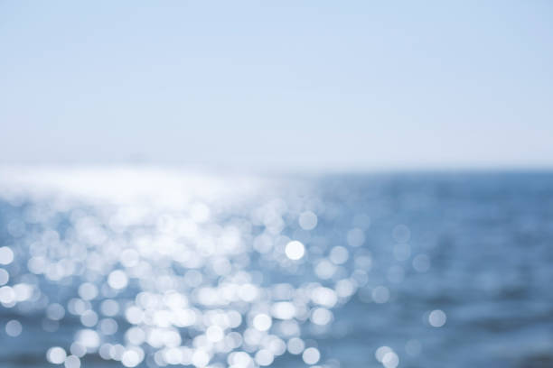 istock Copy space blur tropical beach with bokeh sun light wave on blue sky and white cloud abstract background. Summer vacation outdoor and travel holiday adventure concept. 1279121052