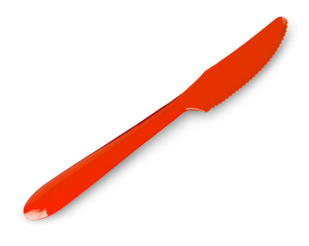 istock red plastic  knife isolated on white background.. Top view 1279124305