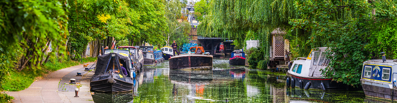 People living and working on the tranquil waters of the Regent’s Canal outside Camden Lock in the heart of Central London, UK.
