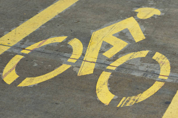 istock Yellow graphic icon indicating a road for bicycle riders. 1279128675