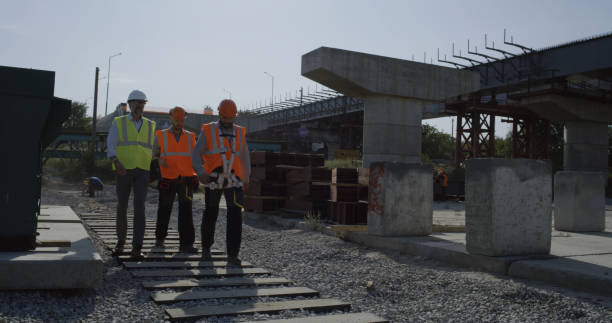 istock Team of engineers walking on construction site 1279129039