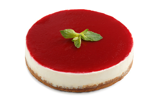 Whole New York style cheesecake isolated on a white background. Whole cheese tart. Homemade creamy cheesecake.