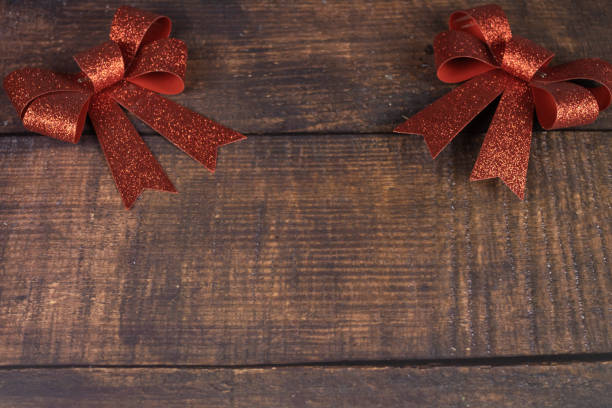 istock red ribbons on a wooden background 1279130075