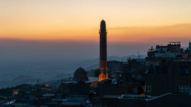 Mardin landscape at sunset with minaret of Ulu Cami, also known as Great mosque of Mardin, Turkey Mardin, Turkey - January 2020: Mardin cityscape at sunset with minaret of Ulu Cami, also known as Great mosque of Mardin ulu camii stock pictures, royalty-free photos & images