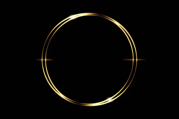 Glowing gold circle ring with light effect on black backdrop, abstract background
