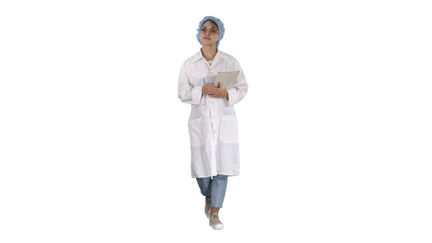 istock Woman doctor walking holding tablet on white background 1279136613