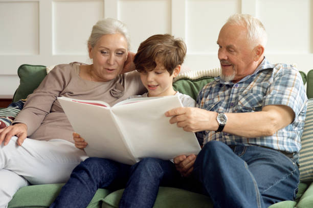 istock Grandparents are reading a book with their grandson 1279136972