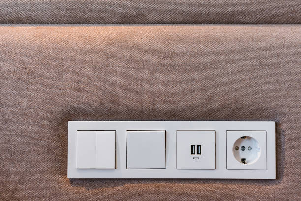 Electric sockets in a soft wall Lamp switches, usb socket and electric socket in a soft wall. usb port photos stock pictures, royalty-free photos & images