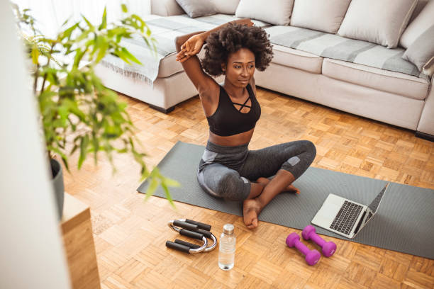 istock Fit woman stretching at home 1279141638