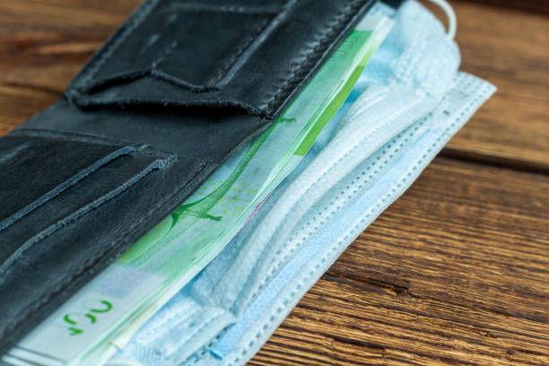 istock wallet with money and protective mask. 1279142182