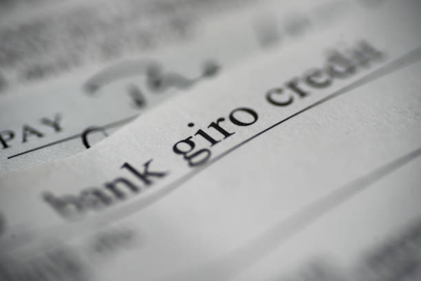 close up part of a bank giro credit slip - bank deposit slip imagens e fotografias de stock