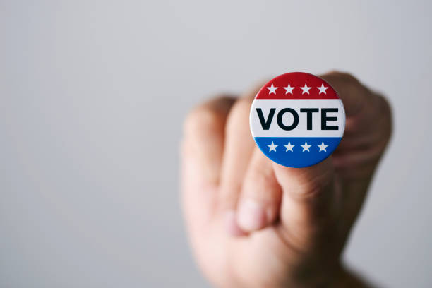 istock man with a vote badge for the US election 1279143318