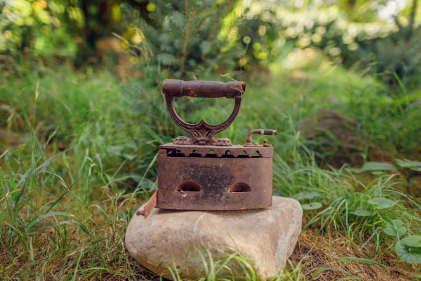 istock vintage iron. retro coal heated iron on a stone 1279143740