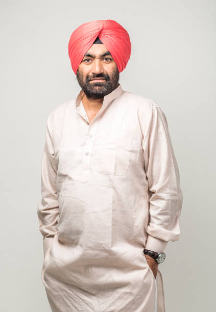 istock Studio portrait of a sikh handsome man looking at camera with smile 1279143852
