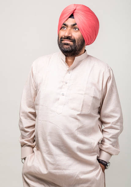 istock Studio portrait of a sikh handsome man looking at camera with smile 1279144011