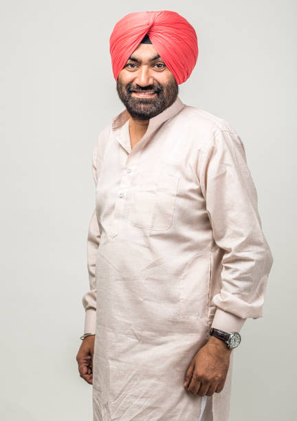 istock Studio portrait of a sikh handsome man looking at camera with smile 1279144238