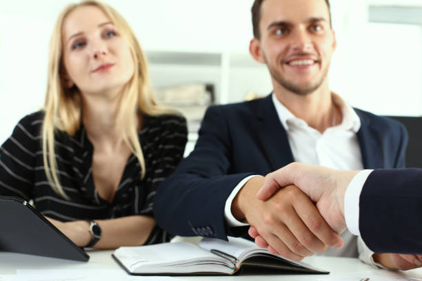 istock Business people shaking hands during meeting in office 1279144791
